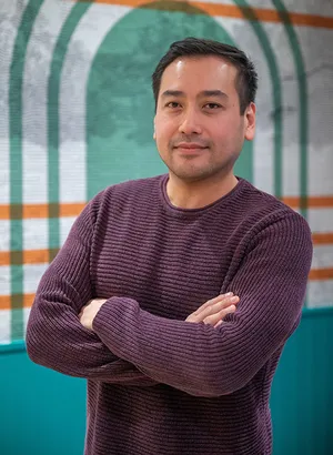 A portrait photograph of Cuong Phan