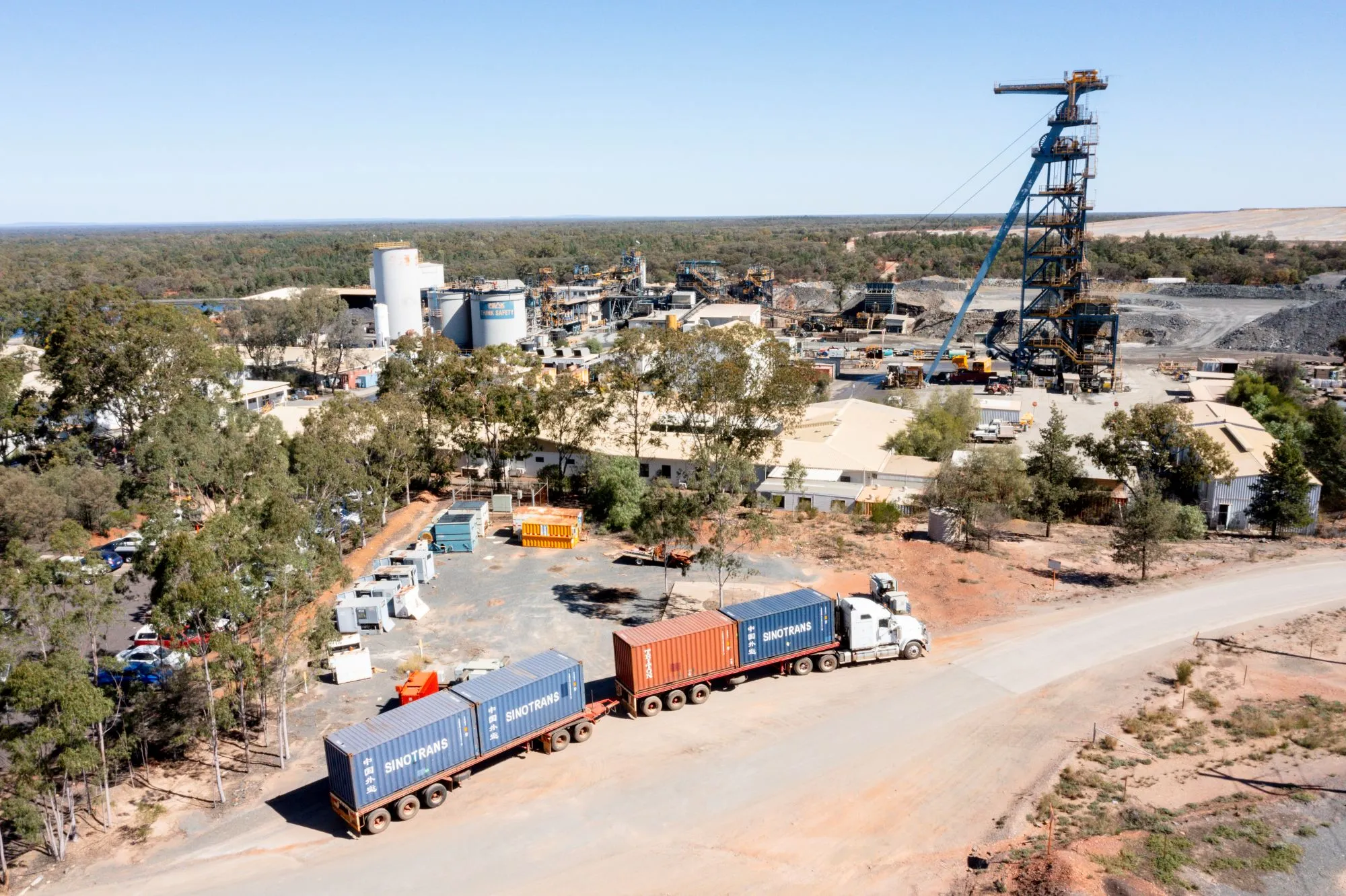 overhead photograph of an Aurelia metals mining site with large trucks in the foreground