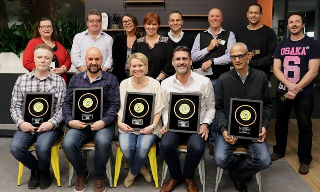 a group of people with awards