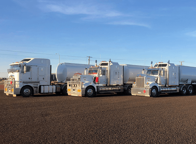 Fleet of freight transport trucks representing truck drivers ready after induction and safety training
